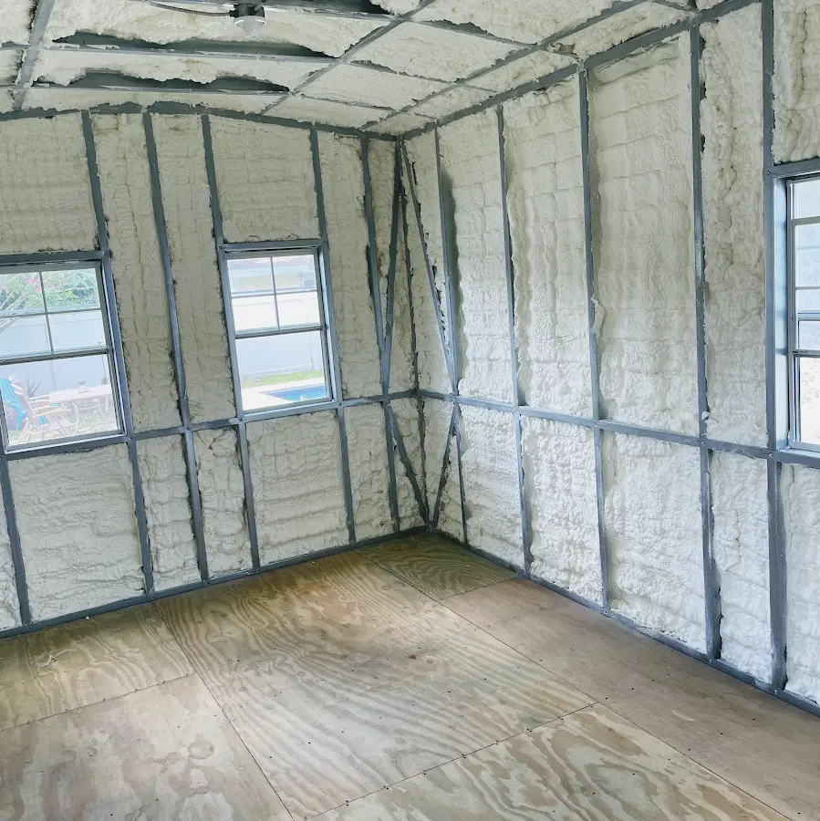 Closed-cell spray foam insulation applied to wall cavities in a residential project in Harvest